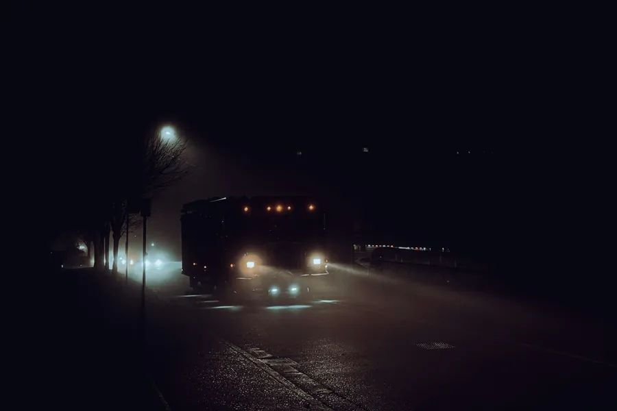 An intercity sleeper bus at a roadside stop