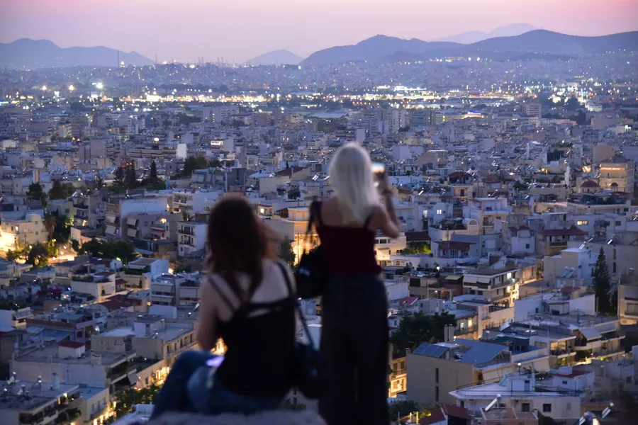 Two travellers walking through a city together