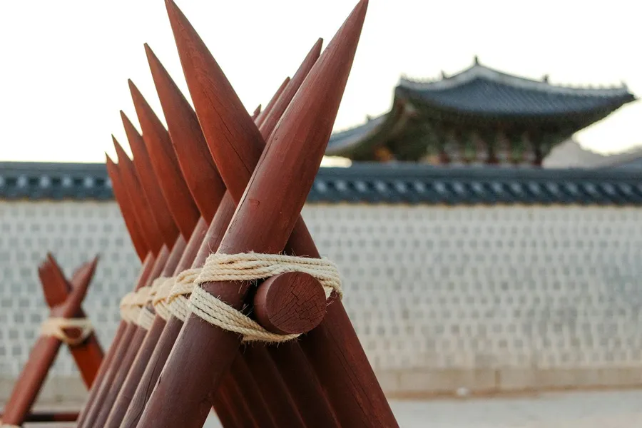 Traditional Korean palace with cherry blossoms