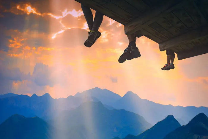 Travellers gathered at a scenic overlook ready for their next adventure